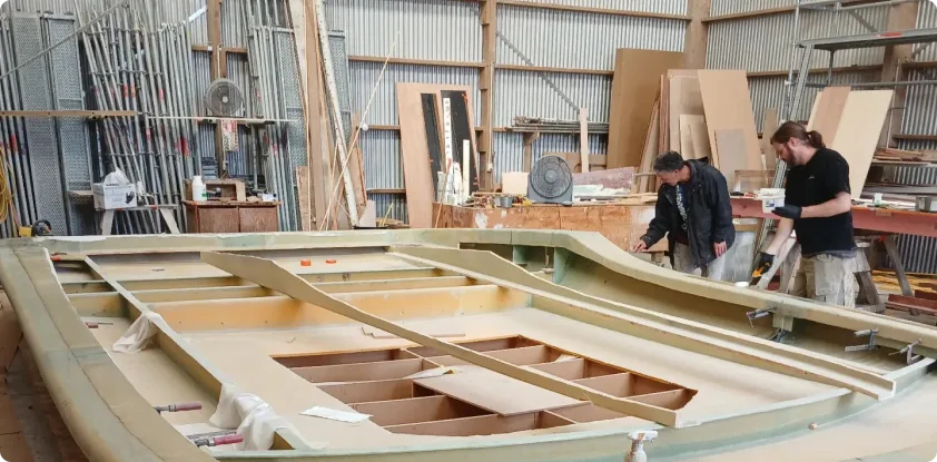 Skilled boat builder performing boat repair